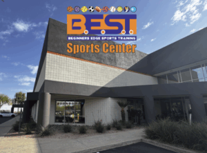 Exterior view of Beginners Edge Sports Training Center building with BEST Sports Center logo and sports icons.